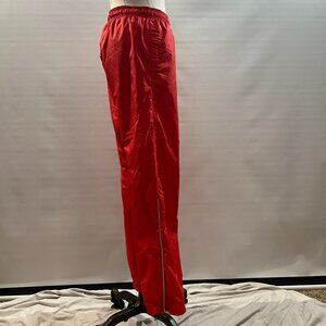 Nike Womens Storm-FIT woven track pants in red. SIze Small
